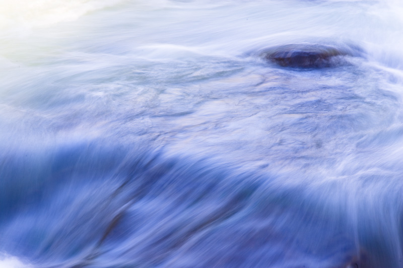 Water Flowing Over Submerged Rock